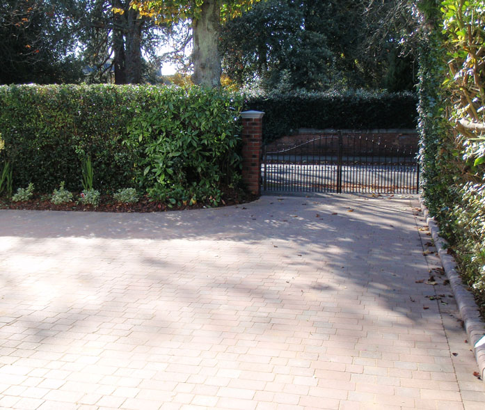 'Antique autumn mix' block paving with bull nose kerbs.