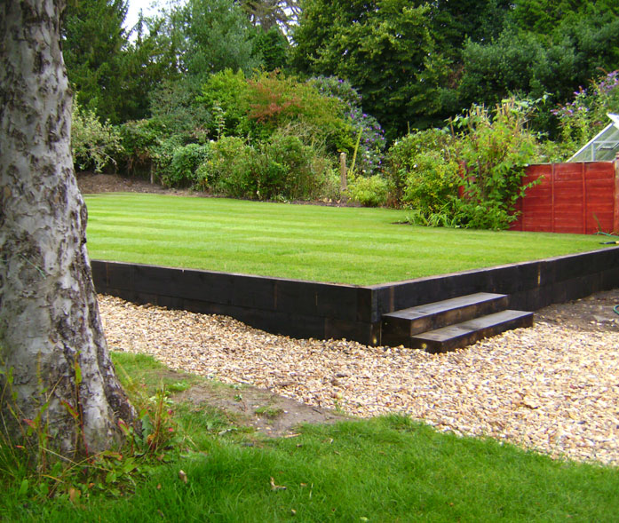 New lawn with new sleeper wall and steps.