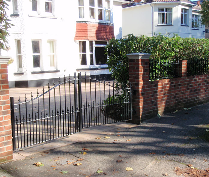 New driveway pillars, gates, front wall and railings.