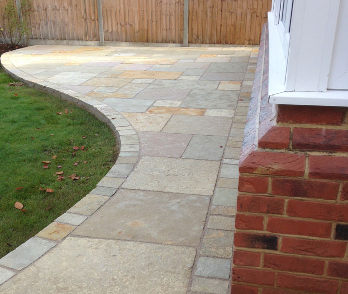 'Tuscan' limestone paving.