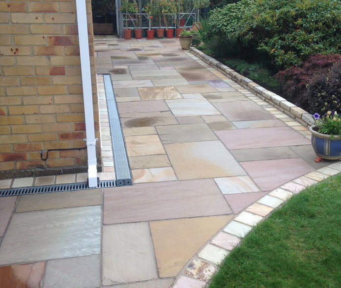 'Tuscan' limestone paving.